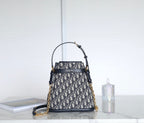MONTAIGNE MEDIUM 24 BUCKET BAG IN BLUE OBLIQUE JACQUARD CALFSKIN