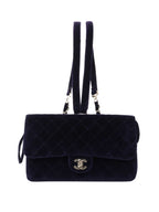 CHNL -   Navy Velvet Classic Flap Backpack.