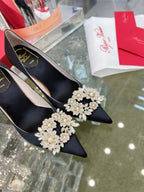 EFFLORESCENCE POINTED-TOE PUMPS IN BLACK SATIN WITH CRYSTAL BUCKLE