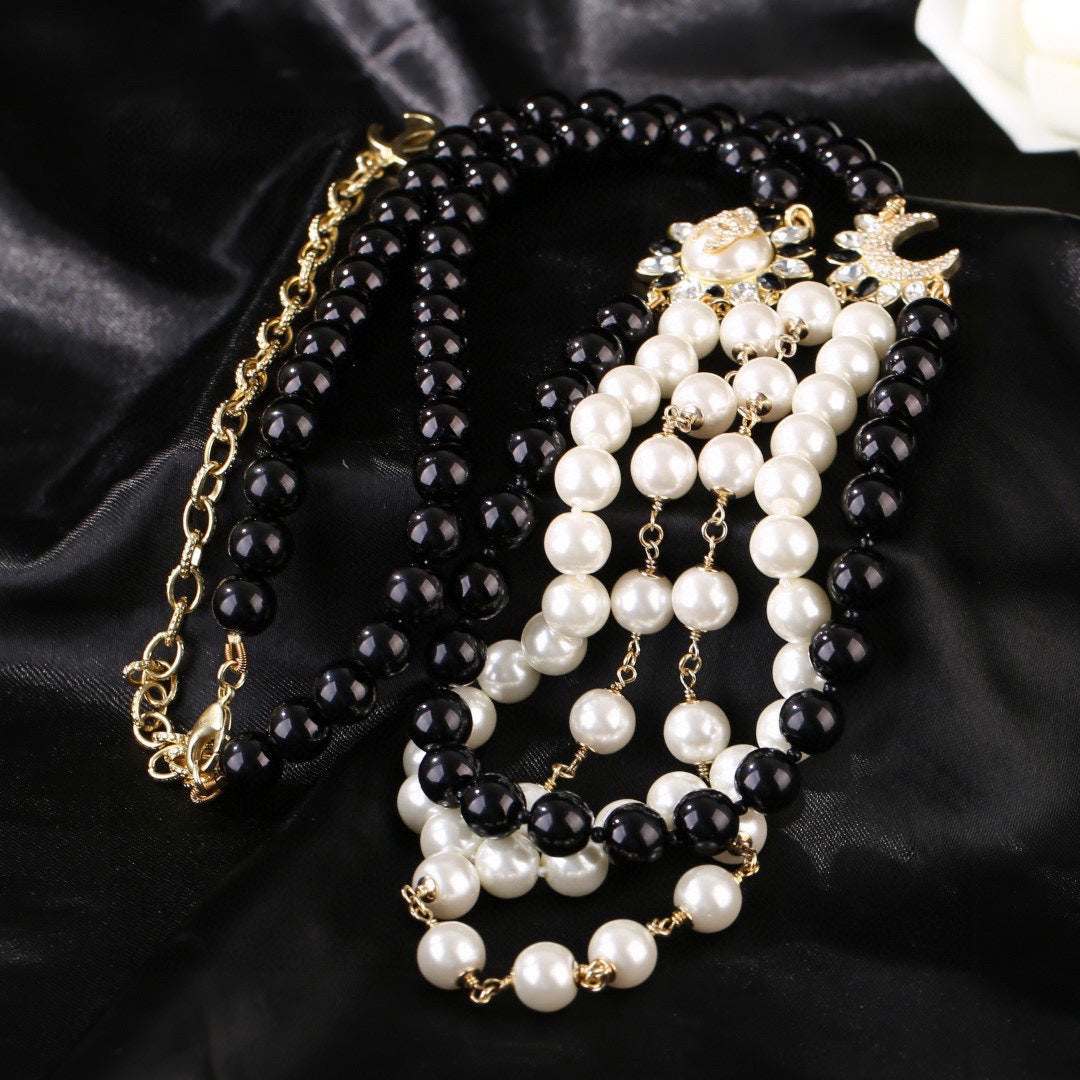 CHANEL 25S CHAIN BELT IN WHITE AND BLACK PEARL 614477