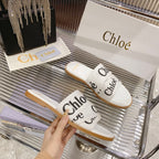 WOODY SLIPPER IN WHITE MIX BLACK CANVAS