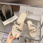 WOODY SLIPPER IN BEIGE MIX BLACK CANVAS