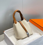 HERMES 25S PICOTIN LOCK 18 IN BURNT ORANGE AND IVORY CALFSKIN SILVER HARDWARE