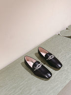 STRASS CHAIN LOAFERS IN BLACK CALFSKIN WITH CRYSTAL CHAIN DETAIL