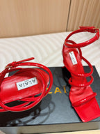 ALAIA THREE-STRAPS HIGH HEEL SANDALS IN CHERRY RED PATENT LAMBSKIN