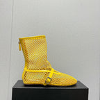 ALAIA SHORT BOOTS IN LEMON YELLOW MESH FISHNET