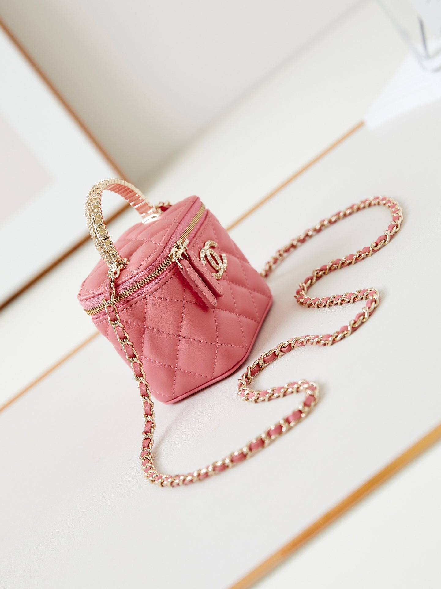 CHANEL 25S MINI VANITY BAG 11 CM IN PEACH PINK LAMBSKIN WITH CRYSTAL-EMBELLISHED CC LOGO