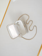 CHANEL 25S MINI VANITY BAG 16 CM IN WHITE LAMBSKIN WITH CRYSTAL-EMBELLISHED CC LOGO