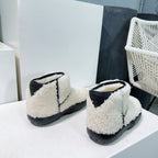 MINI ANKLE BOOT IN WHITE SHEARLING WITH BLACK ULTRA LIGHTWEIGHT RUBBER OUTSOLE