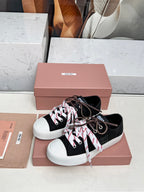 WASHED-DENIM SNEAKERS IN BLACK CANVAS WITH BROWN AND STRIPED LACES