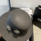 FLAT STRAW HAT BLACK FLOWER ATTACHMENT 673929