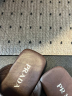 PRADA 25S SHUFFLE LEATHER THONG SANDALS IN BROWN CALFSKIN