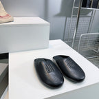 BALENCIAGA 25S MULES IN BLACK LAMBSKIN