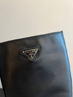 PRADA 25S HIGH-CUT PLATFORM BOOTS IN BLACK CALFSKIN WITH SILVER HARDWARE