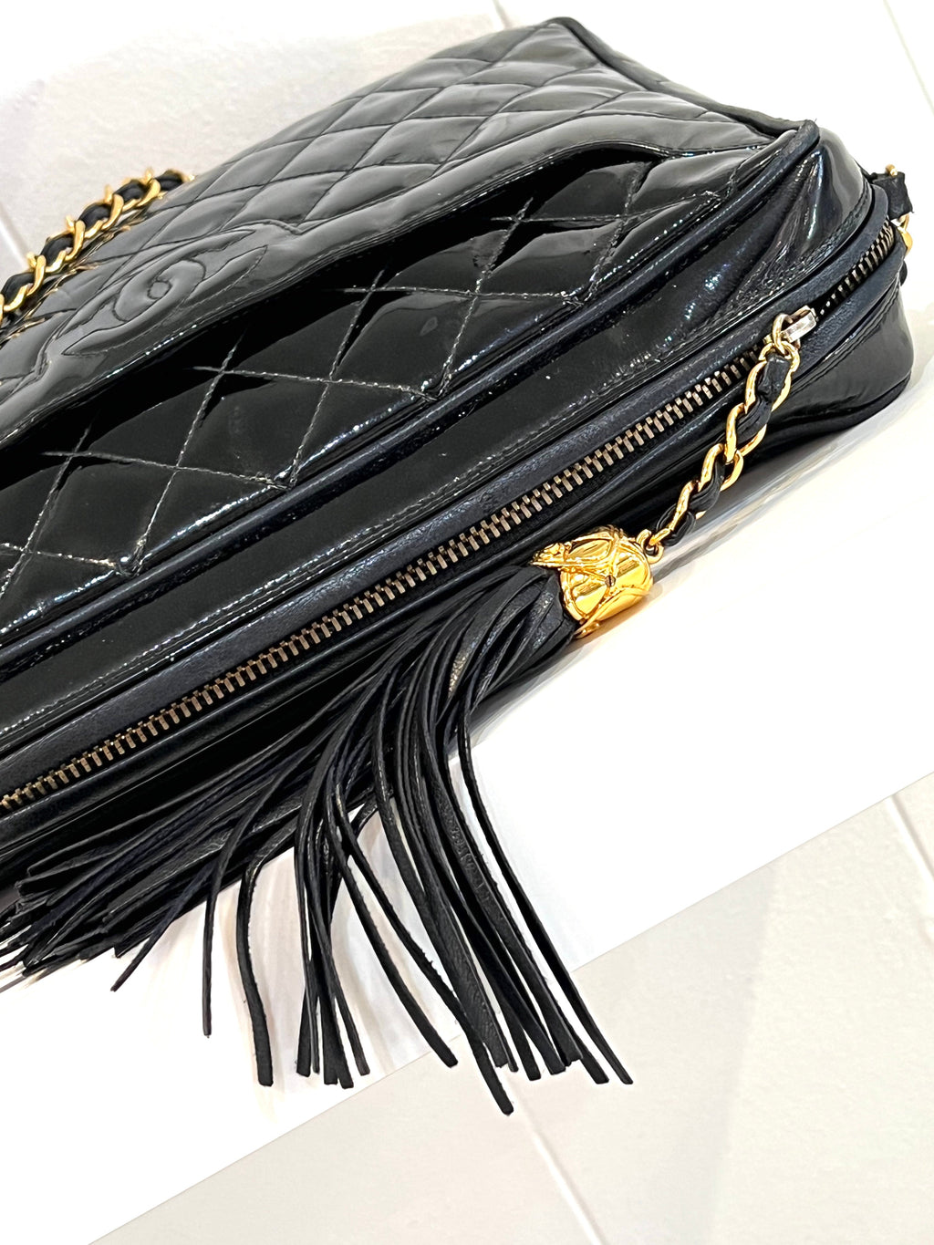 CHL -   QUILTED PATENT CAMERA TASSEL MEDIUM BAG