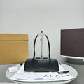 LE TECKEL SHOULDER BAG 32 BLACK CALFSKIN