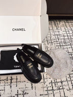 SLINGBACK LOAFER IN BLACK CALFSKIN AND SHEARLING