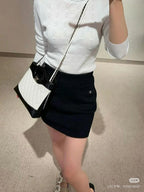 CC ICONIC SKIRT IN BLACK WOOL KNIT WITH FRONT POCKETS