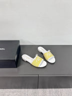 CC STRIPED SLIDE SANDALS IN YELLOW AND WHITE CANVAS