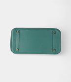 The  HM BK 30 Green Leather Handbag is a timeless symbol of luxury