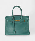 The  HM BK 30 Green Leather Handbag is a timeless symbol of luxury