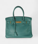 The  HM BK 30 Green Leather Handbag is a timeless symbol of luxury