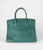 The  HM BK 30 Green Leather Handbag is a timeless symbol of luxury