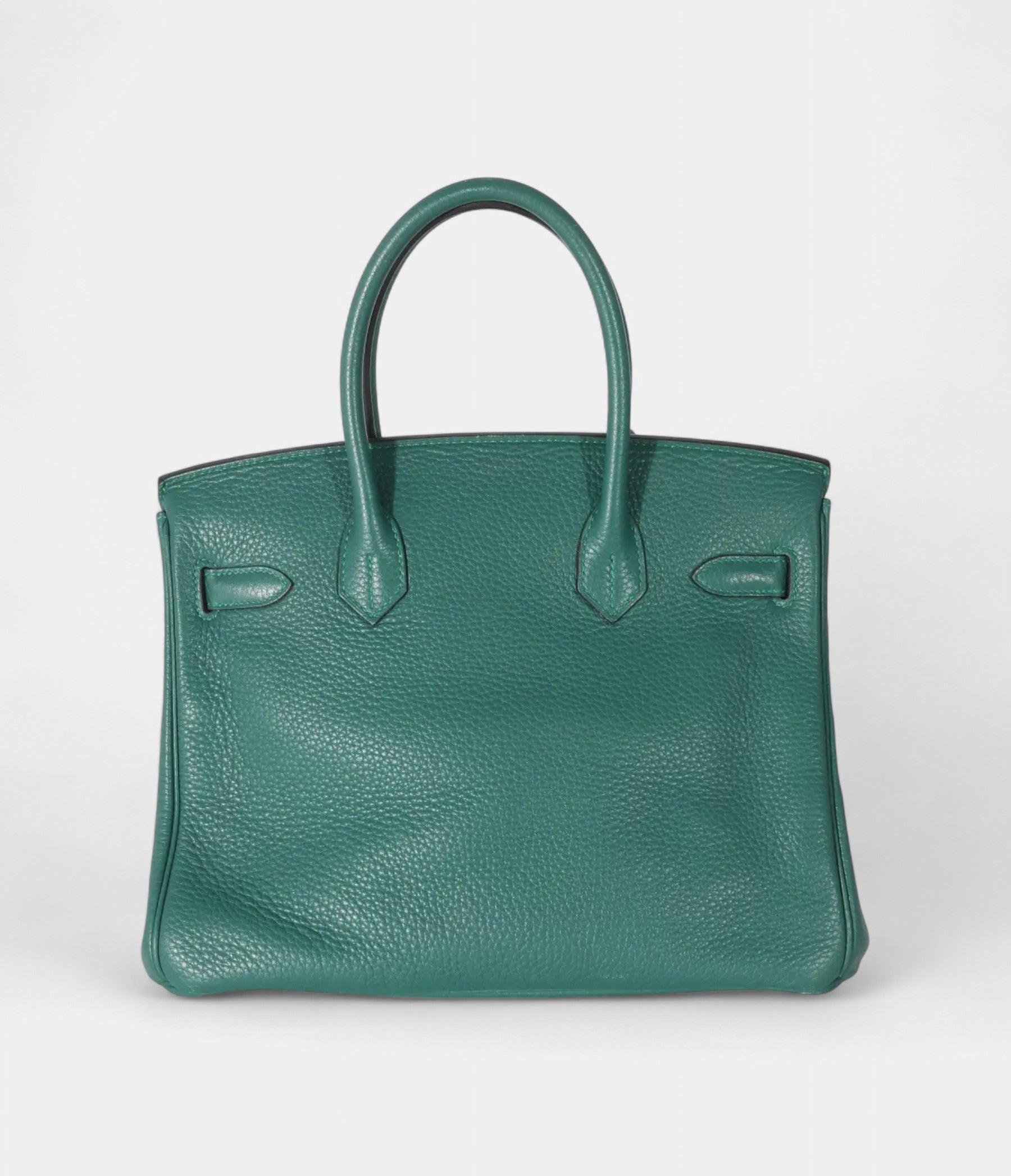 The  HM BK 30 Green Leather Handbag is a timeless symbol of luxury
