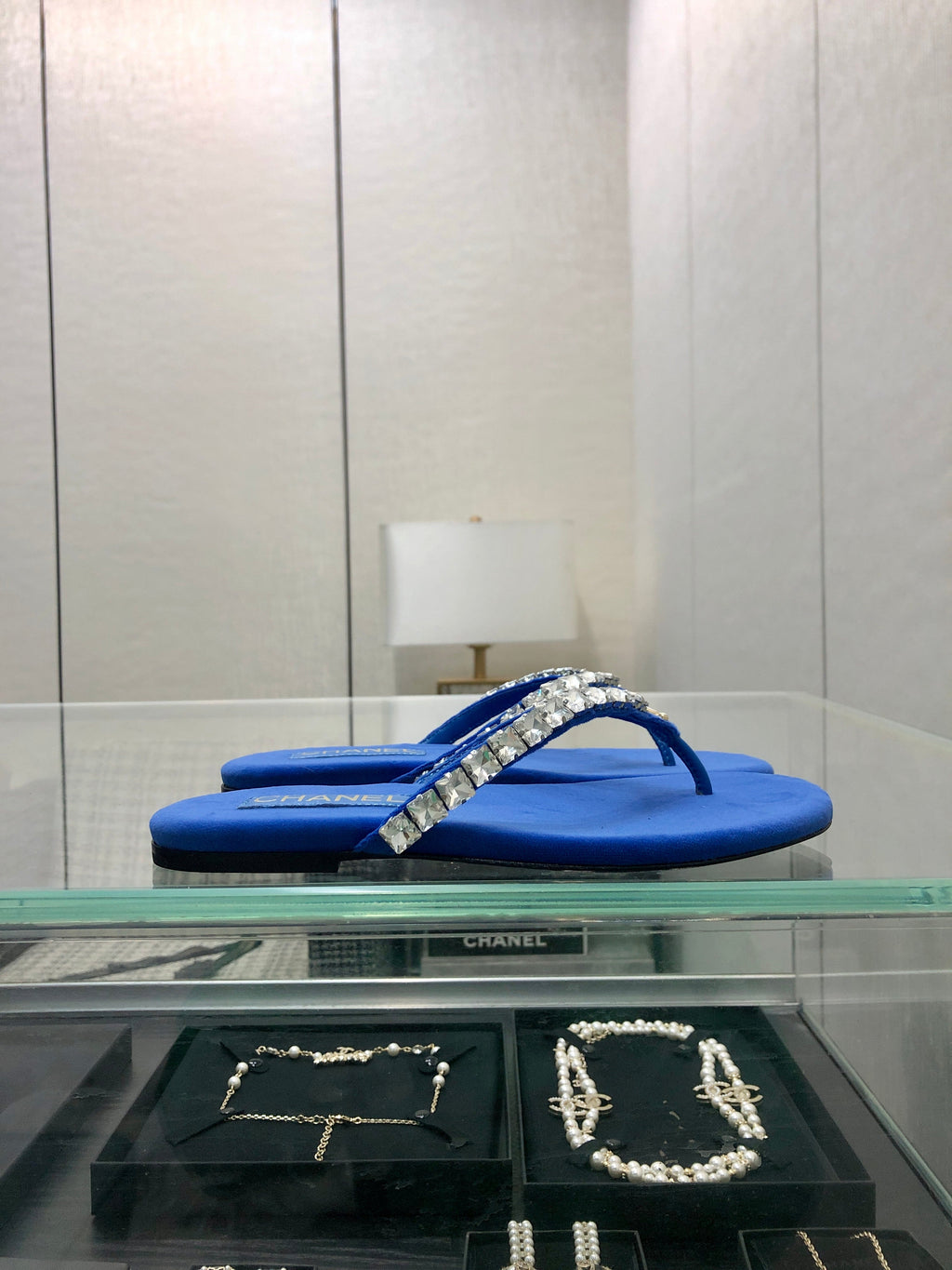 THONG SLIDE IN COBALT BLUE SUEDE WITH WHITE CRYSTALS