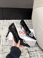 POINTED HIGH PUMPS IN BLACK PATENT CALFSKIN WITH CRYSTAL BUCKLE