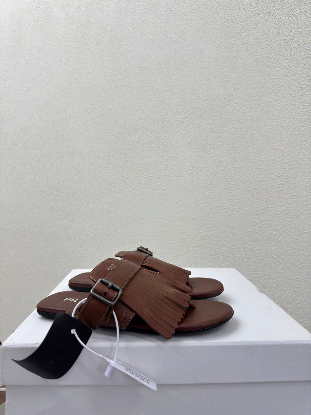PRADA 25S SHUFFLE LEATHER THONG SANDALS IN SIENNA CALFSKIN