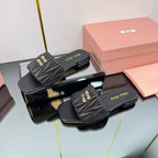 MATELASSÉ SLIDES IN BLACK CALFSKIN