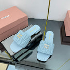 MATELASSÉ SLIDES IN BABY BLUE CALFSKIN
