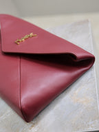 YSL 25S CASSANDRE LARGE ENVELOPE POUCH 29 IN DARK RUBY SHINY CALFSKIN GOLD HARDWARE