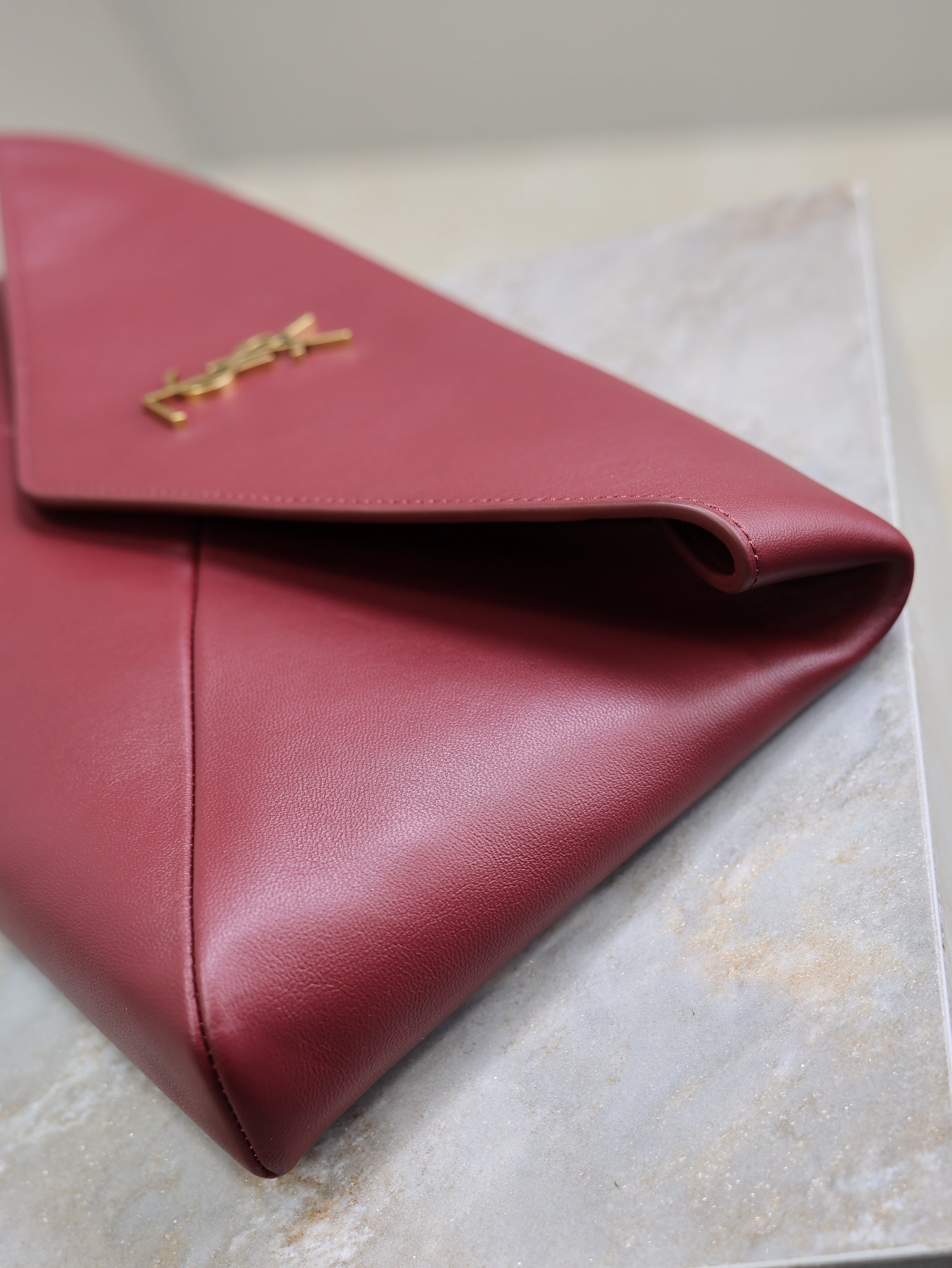 YSL 25S CASSANDRE LARGE ENVELOPE POUCH 29 IN DARK RUBY SHINY CALFSKIN GOLD HARDWARE