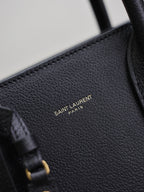YSL 25S SAC DE JOUR GM 32 IN BLACK SUPPLE GRAINED CALFSKIN GOLD HARDWRE