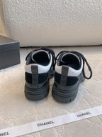 CHANEL 25S TRAINERS 40MM IN BLACK AND WHITE CALFSKIN AND SUEDE