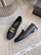 CHANEL 25S LOAFERS WITH LARGE LOGO IN BLACK CALFSKIN GOLD HARDWARE