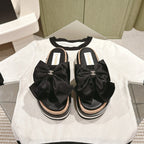 CC SLIPPERS WITH SILK BOW IN BLACK COWHIDE