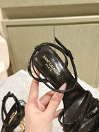 YSL 25S HIGH-HEEL SANDALS 100 MM IN BLACK GLOSSY LAMBSKIN WITH YSL LOGO HEEL DESIGN IN GOLD