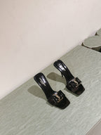 YSL 25S SQUARE-TOE HIGH-HEEL SANDALS 100 MM IN BLACK GLOSSY LAMBSKIN WITH GOLD HARDWARE