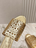 ALAIA PERFORATED SLIDE SANDALS 25S IN LIGHT GOLD LAMBSKIN