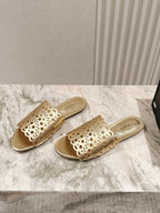 ALAIA PERFORATED SLIDE SANDALS 25S IN LIGHT GOLD LAMBSKIN
