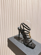 YSL 25S STILETTO HIGH-HEEL SANDALS 100 MM IN BLACK LAMBSKIN WITH GOLD HARDWARE