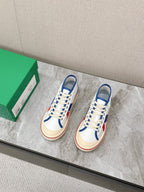 ELIOT SNEAKER IN WHITE CANVAS WITH NAVY BLUE CALFSKIN