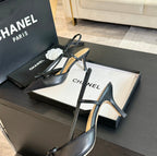 SLINGBACK WITH BOW IN BLACK LAMBSKIN