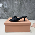 HIGH - HEEL BLACK SHEEPSKIN WITH STYLIZED STRAPS