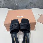 HIGH - HEEL BLACK SHEEPSKIN WITH STYLIZED STRAPS