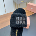 SLIPPERS IN BLACK LAMB WOOL