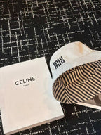 MM CLASSIC REVERSIBLE BUCKET HAT IN LIGHT BEIGE AND BLACK FABRIC